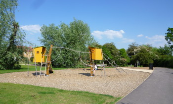 Colourful play equipment associated with green spine